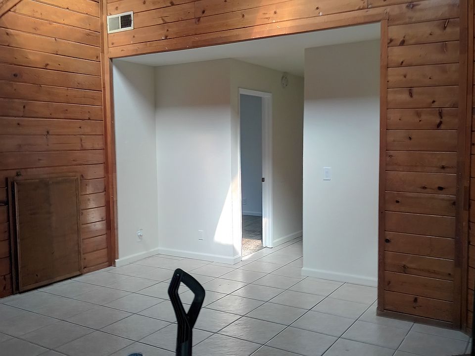 Living room w/under stair rail storage .
__ Fire place in living room