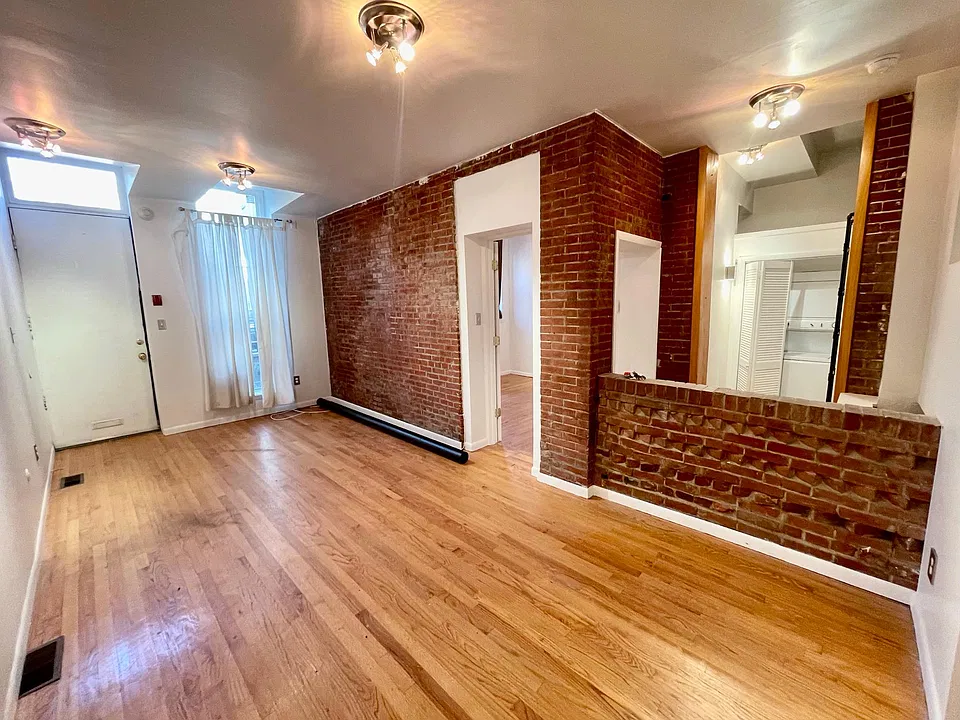 Exposed brick features.