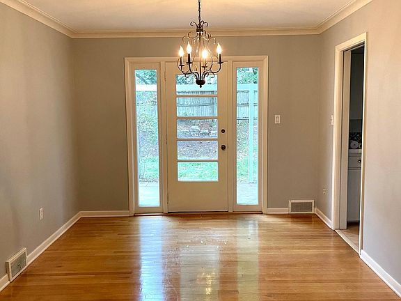 Dining area with a door that leads to back yard and concrete patio