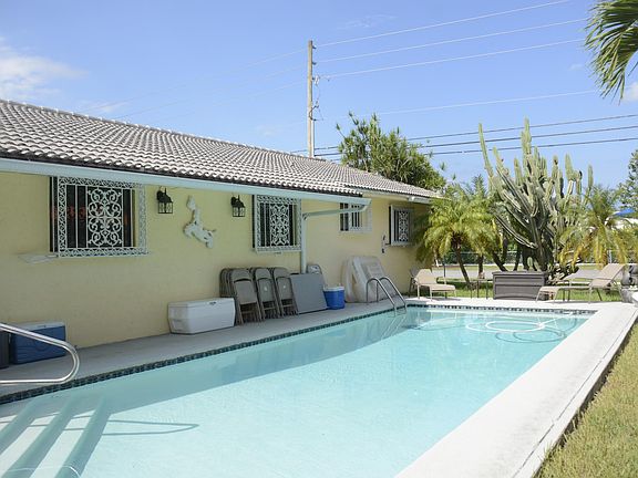 Back of the house and 30 foot swimming pool.