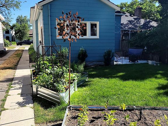 Back yard is a gardener's dream with raised beds for planting.