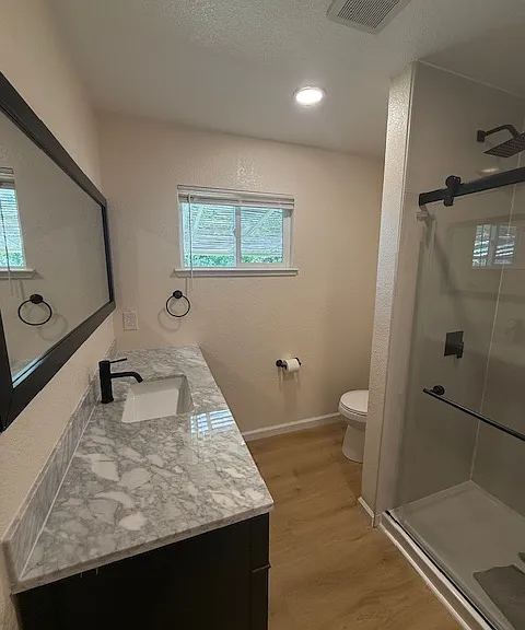 Beautiful bathroom with brand new vanity and shower.