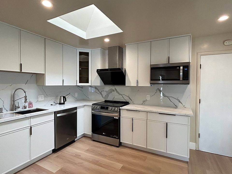 Brand new appliances, build-in microwave, quartz countertops, soft-close cabinets