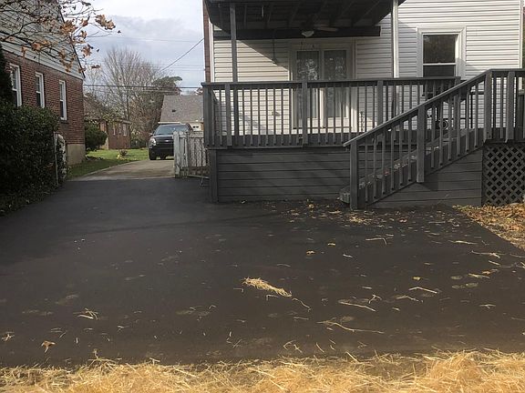 Covered back porch with new driveway