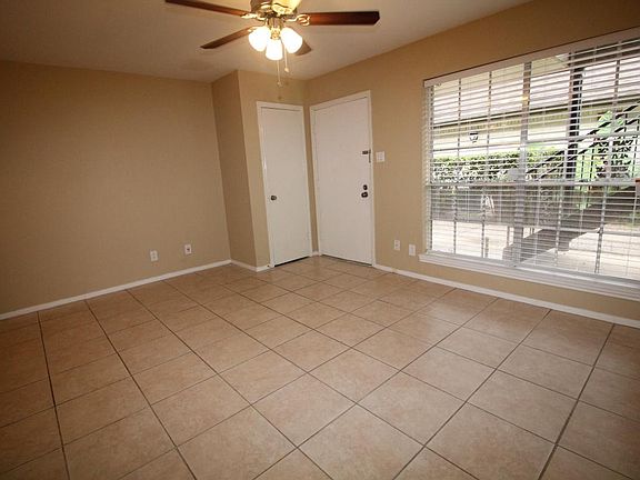 Large Living Room with coat closet, 18" tile flooring, ceil
