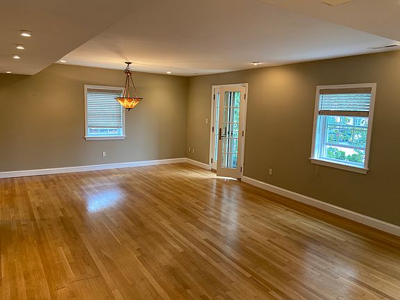 Opposite view of open dinning room / living room space w French doors to Juliet balcony