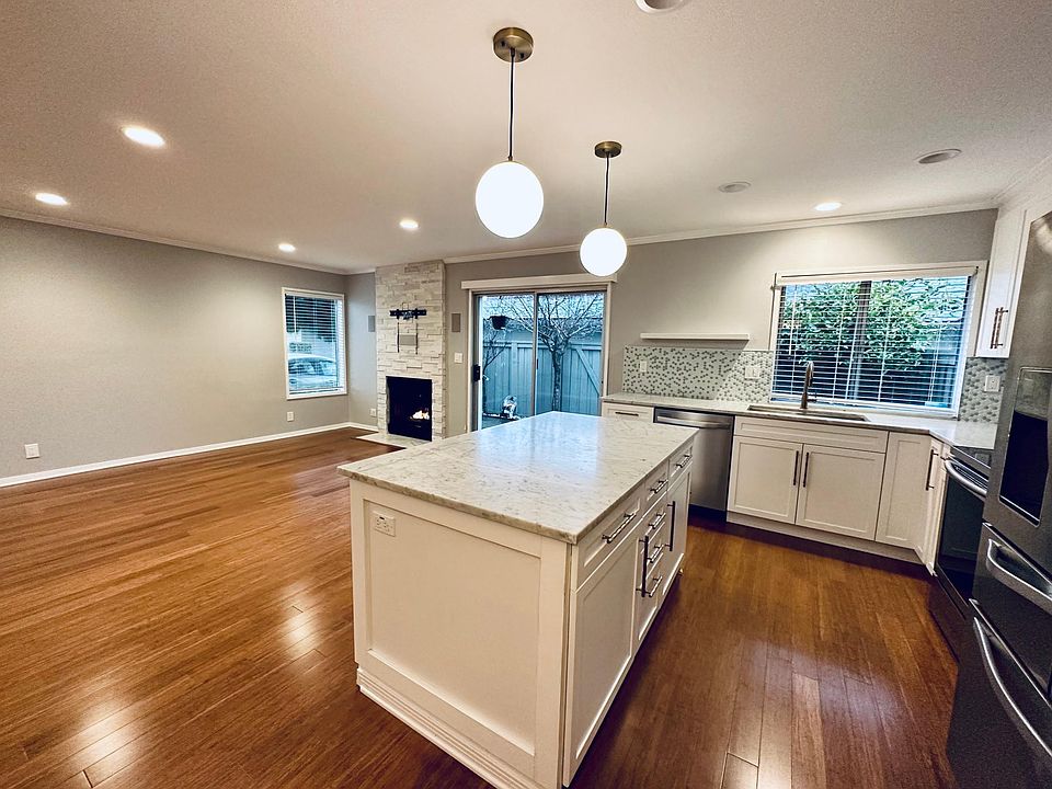 Contemporary open floor plan with remodeled kitchen, gas-fireplace, and recessed lighting!
