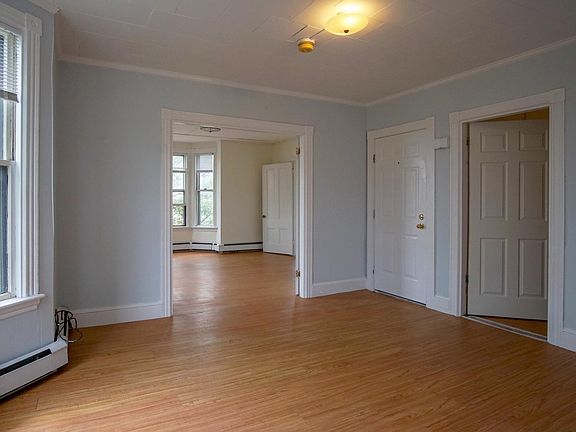 View from kitchen, through dining/living room, and into master bedroom/living room