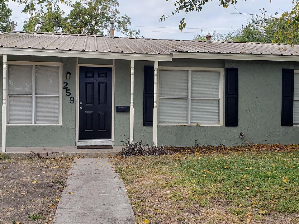 Fresh paint, metal roof, new shutters make for great curb appeal.