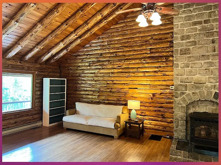 Family room / kitchen has high ceilings, pellet stove and great views of the lawn and pond.