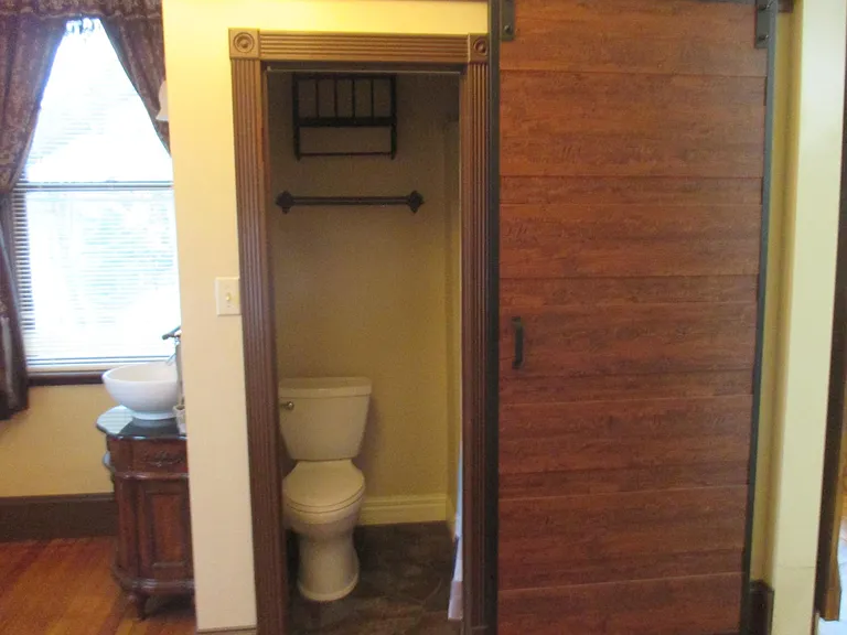 Bathroom and vanity in bedroom