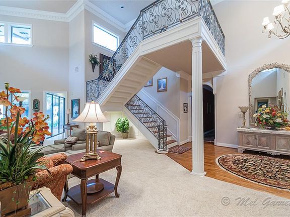 Ornate staircase with wrought iron work