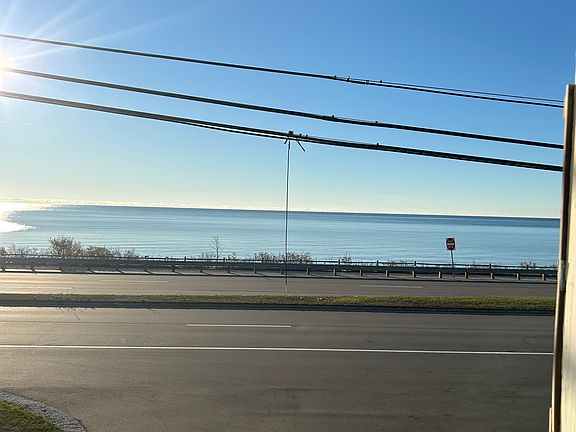 Incredible, wide view of Lake Michigan from most rooms in this property. This view is from the front porch