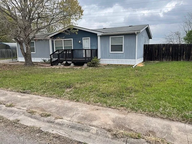 One-third of an acre with wooden front deck.