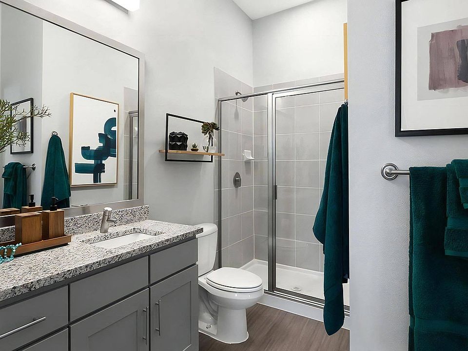 Rhythm Bathroom with Large Shower and Quartz Countertop Vanity