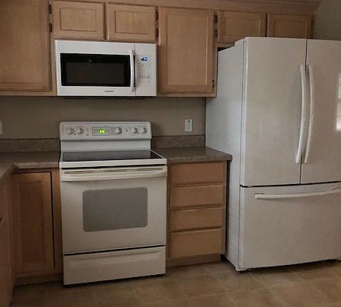 Kitchen appliances, dishwasher is on the left by the double sink