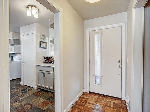 Vintage door with a charming entrance ...and a peek into the kitchen with great pantry and wine/coffee bar!