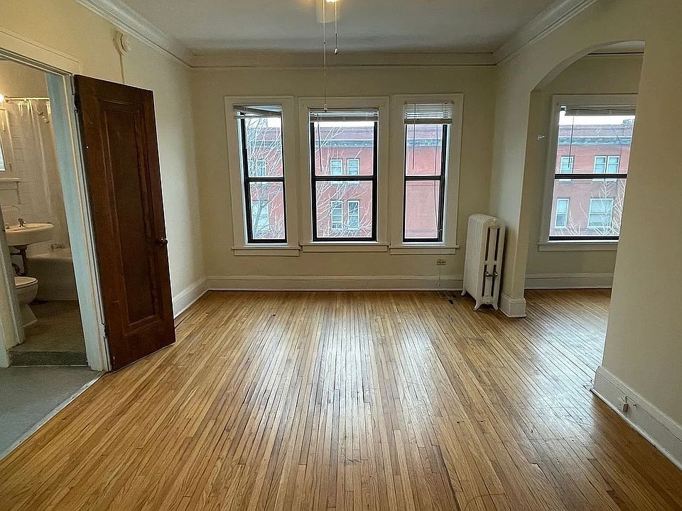 Step into the inviting ambiance of LS Capital Group. This light-filled room boasts beautiful hardwood floors and large windows that enhance its charm. Perfect for creating your ideal living space. Schedule your tour today!