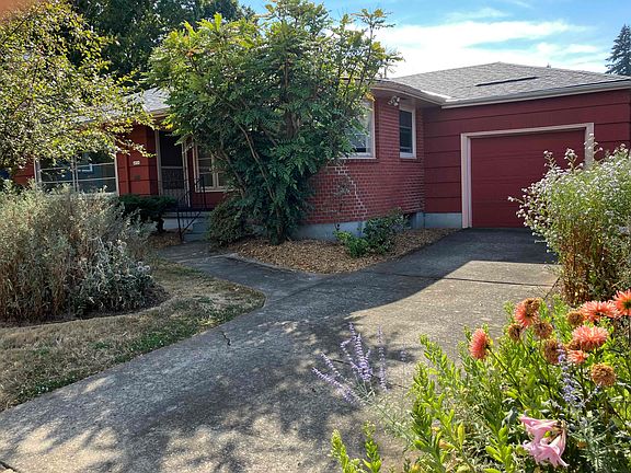 View of house and attached garage from NE 36th Ave.