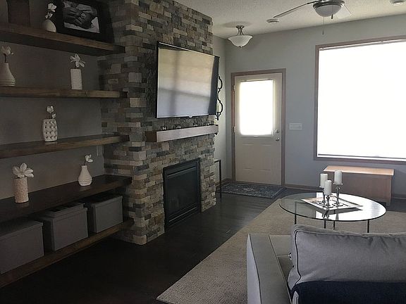 Stone fireplace and shelves