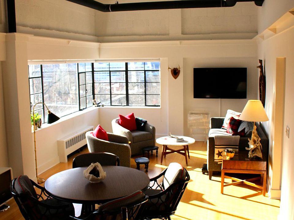 Large open floor plan living, dining and kitchen loft space with 14 foot ceilings, tons of light and spectacular views.