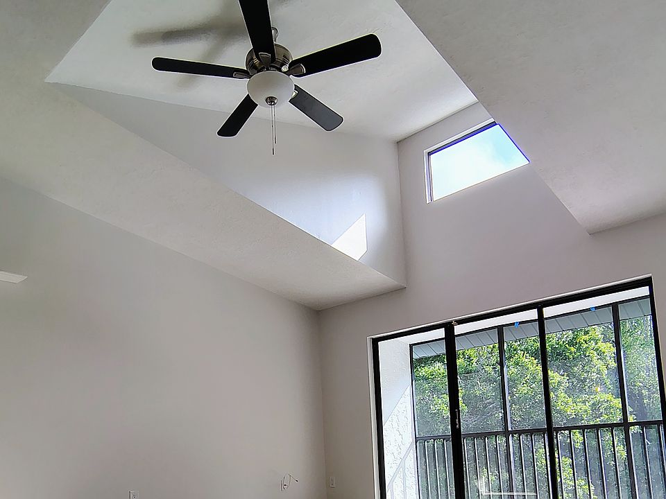 Vaulted ceiling over DR and LR w/view of balcony and preserve