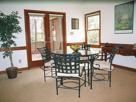 Dining rm with French doors to deck