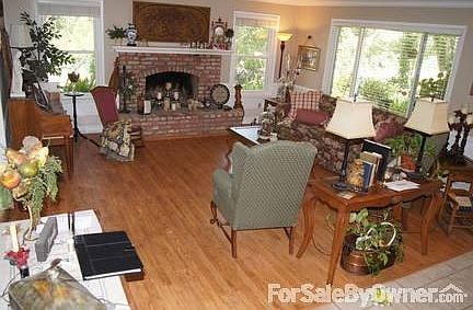 Great fireplace large living room
						:
						spacious living room with windows thru out