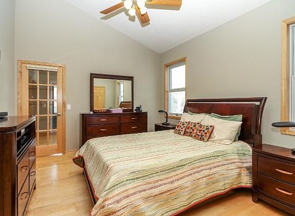 MASTER WITH FRENCH DOOR TO SUN ROOM.  VAULTED CEILING, BUILT IN CALIFORNIA CLOSETS, MAPLE FLS, PELLA WINDOWS WITH BUILT IN BLINDS IN GLASS.