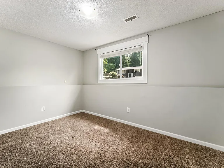 Lower Level Bedroom, updated with LVP Flooring.
