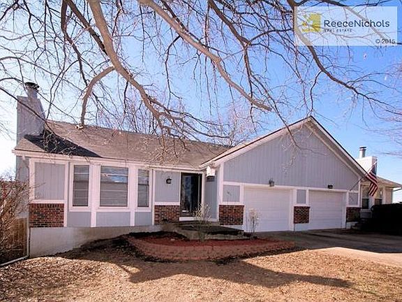 View of home with a view of home with adjoining home.