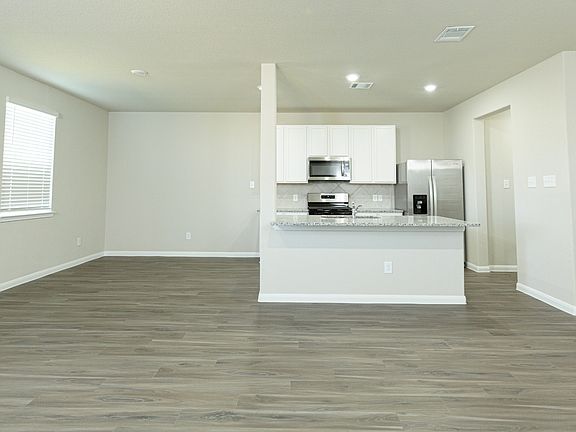 Family Room to Kitchen and Dining Area