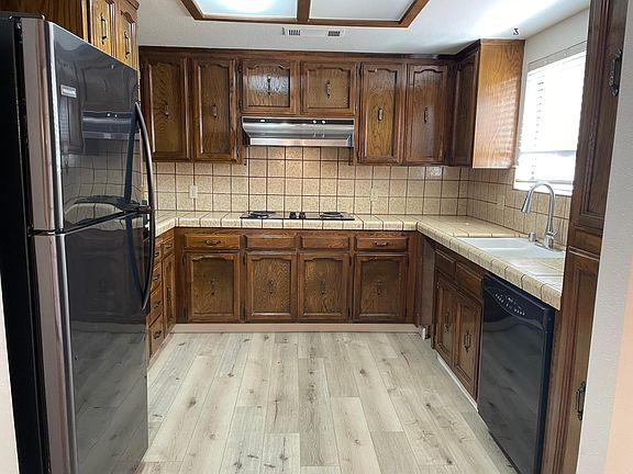 Kitchen includes refrigerator.