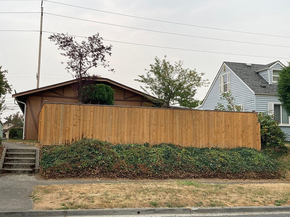 view from street - fenced yard with gate