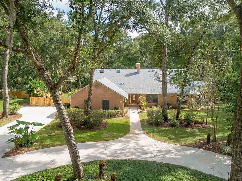 This custom home is located on a beautiful large lot, with manicured grounds on a .79 acres.