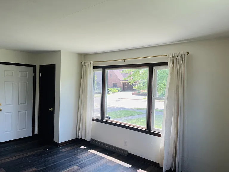 Family room, coat closet, living space. Left of door would be perfect for a TV or even electric fireplace.