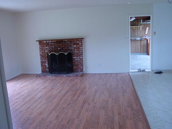Living/dining/edge of kitchen, looking through door into garage.