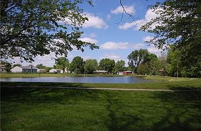 Directly behind home is a walking path and pond area