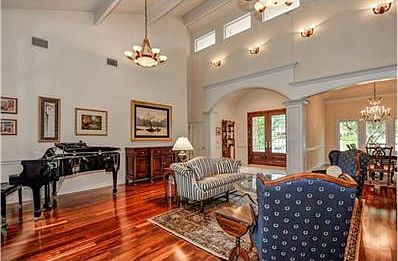 Spacious living room with high ceilings and designer lighting