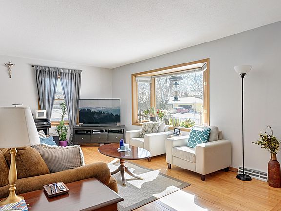 Living room with windows on South and West sides, for a light and bright home!
