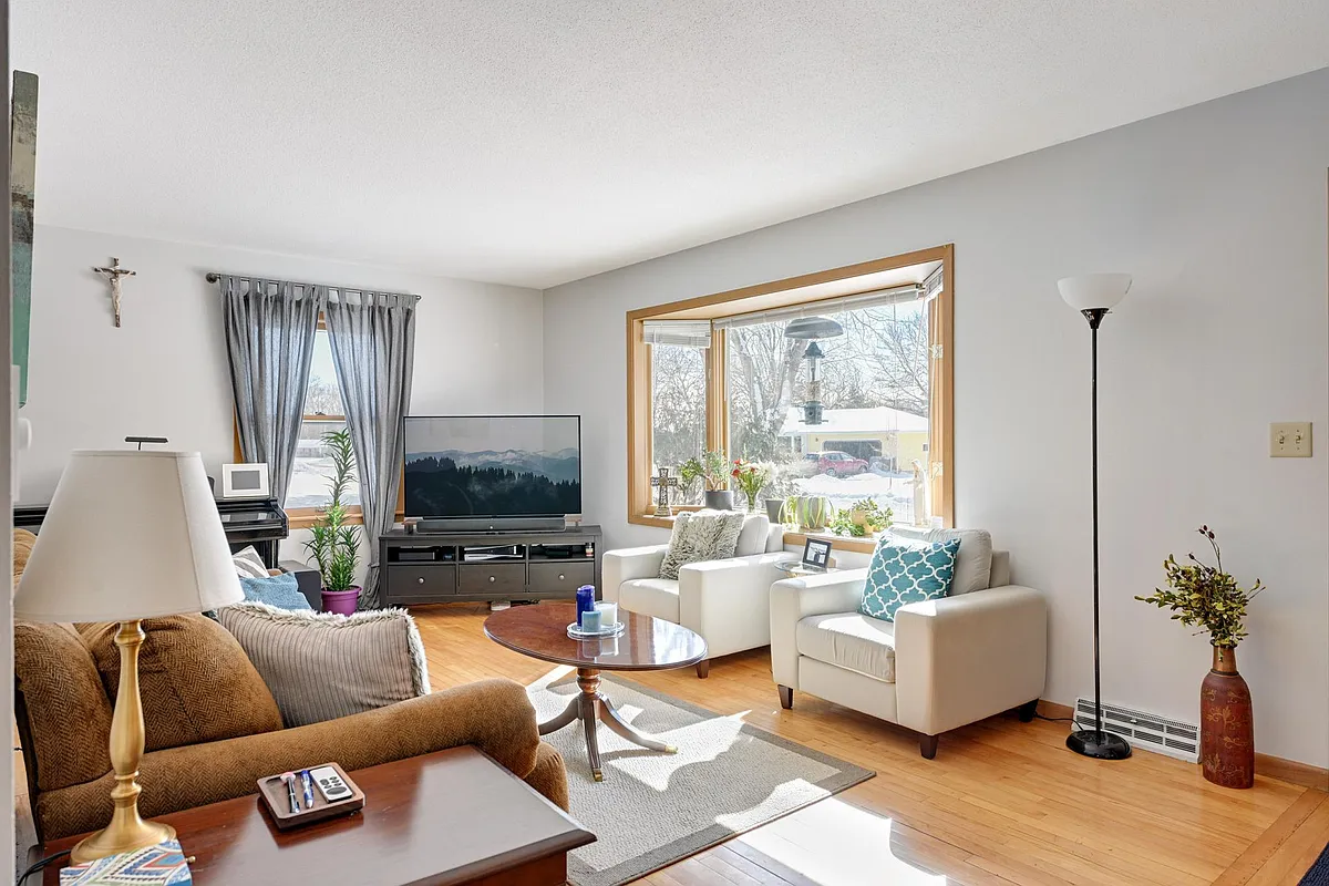 Living room with windows on South and West sides, for a light and bright home! - 8909 Morris Rd