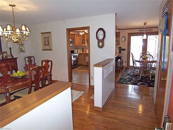 Entry showing dining room to left and kitchen straight ahead.