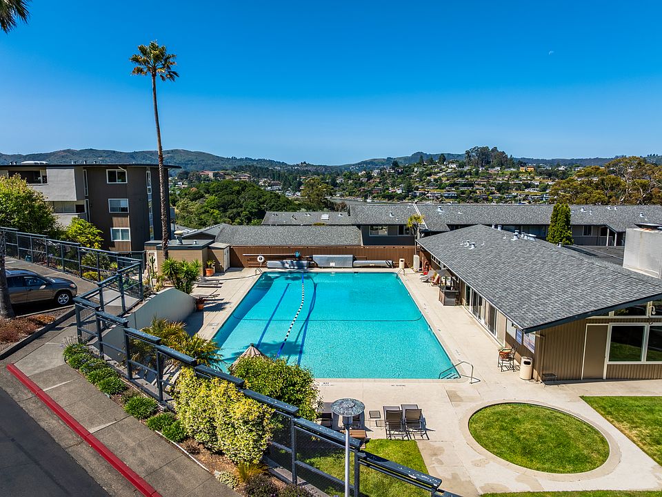 Relax poolside while enjoying sweeping views of the surrounding hills.