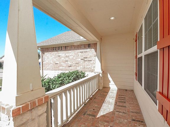 Enjoy sunsets and chatting with your neighbors on your bricked front porch!