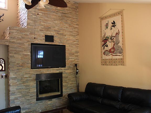 Beautiful stonework with gas fireplace, opening for a TV