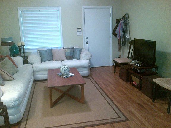 Another view of living/dining area leading to front entry which leads to cool courtyard.