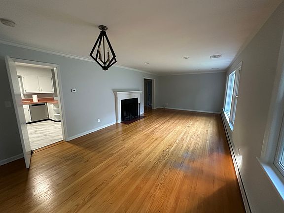 Family Room/Dining Room with wood burning fireplace.