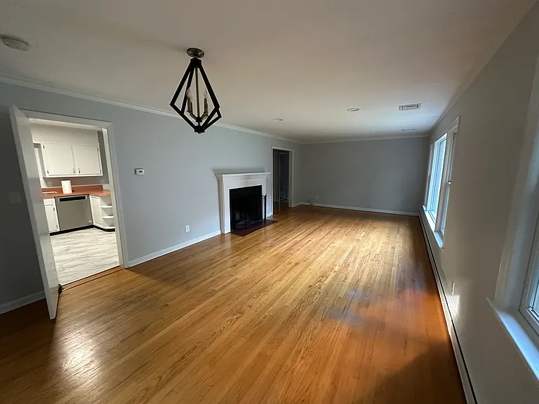 Family Room/Dining Room with wood burning fireplace.