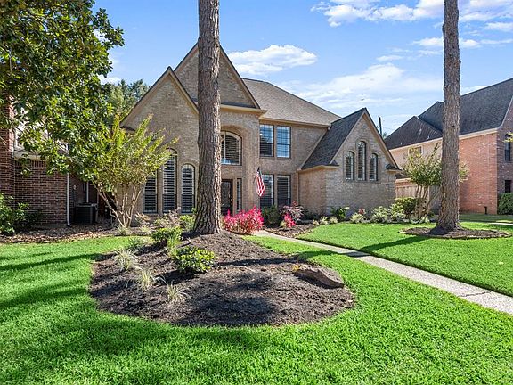 Take a look at the beautiful, yet low maintenance landscaping. This home has a sprinkler system in both the front and back yard.