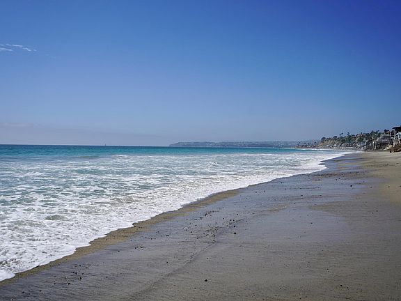 EXPANSIVE BEACH IN FRONT OF HOUSE LOOKING NORTH TO DANA POINT